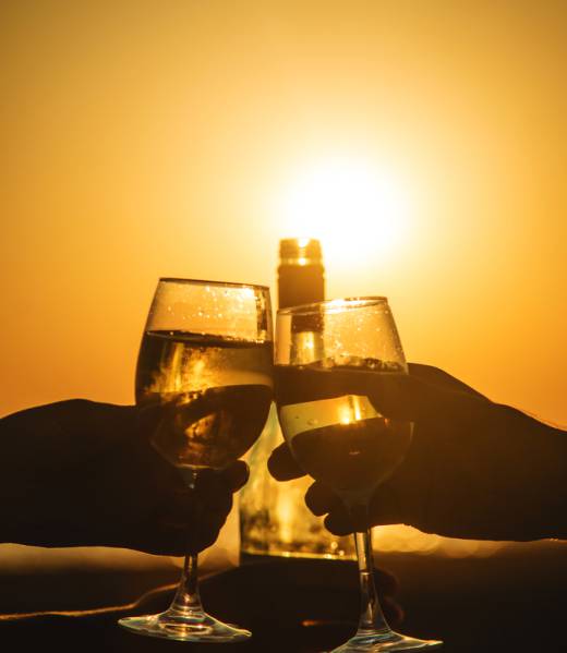 Wine glasses at sunset on the beach. Selective focus. Nature.
